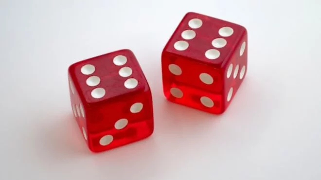 What do dice represent spiritually?